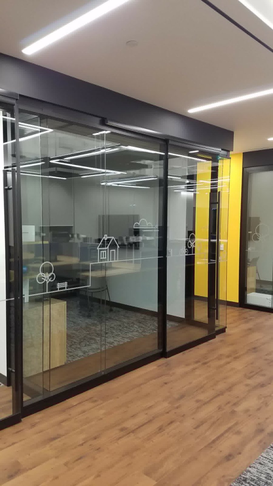 Glass meeting room with sliding doors installed by SOIS