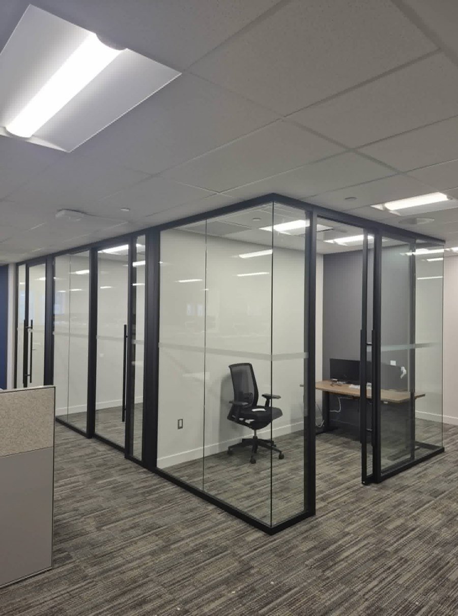Suite of glass-front offices installed along a corridor