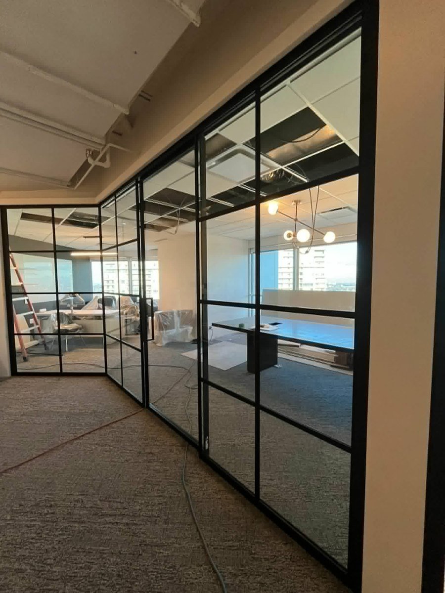 Industrial-style architectural glass walls installed by SOIS